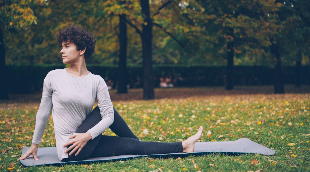 woman doing yoga in park