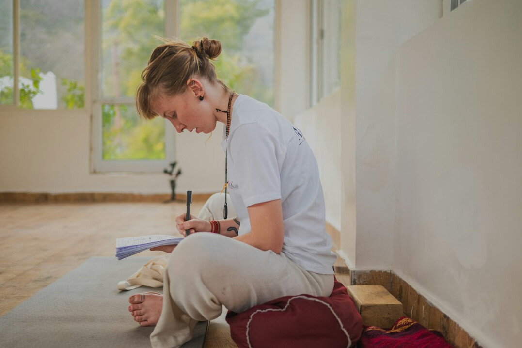 woman sitting peacefully indoors