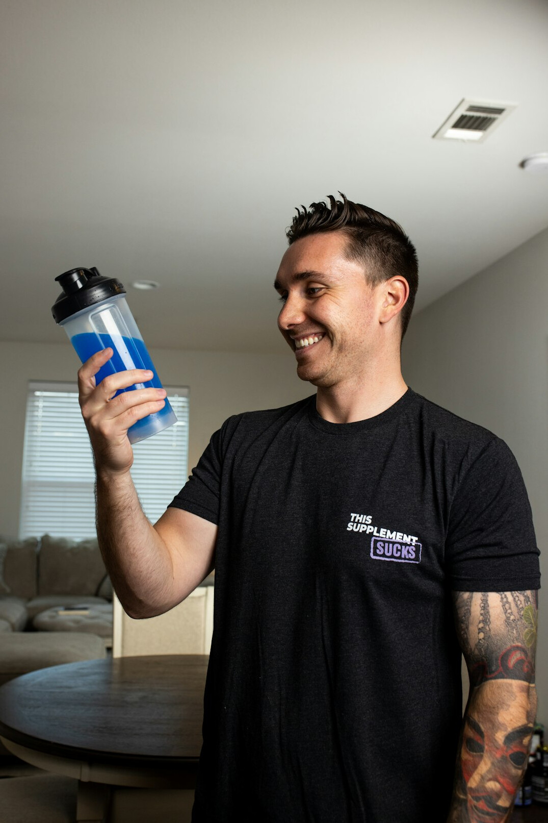 Studio portrait of a Slovenian male health coach in a smart casual shirt